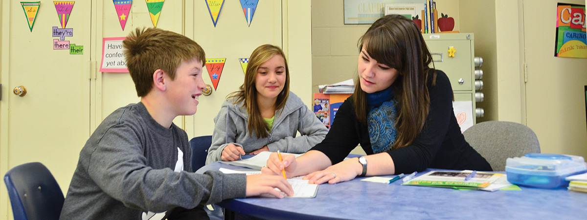 Bachelor of Education student helping young learners