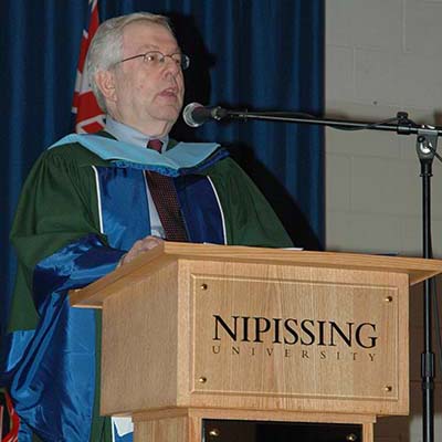 Dr. David Booth delivering convocation address