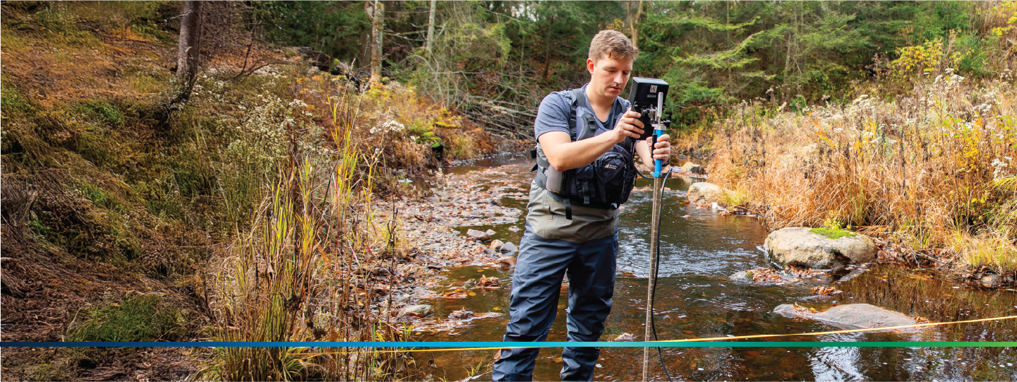 A person doing research in a creek 