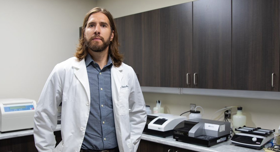 Dr. Steven Arnockyin his lab.