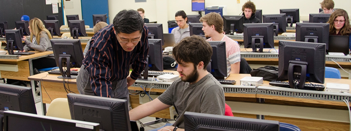 students and professor in a computer lab
