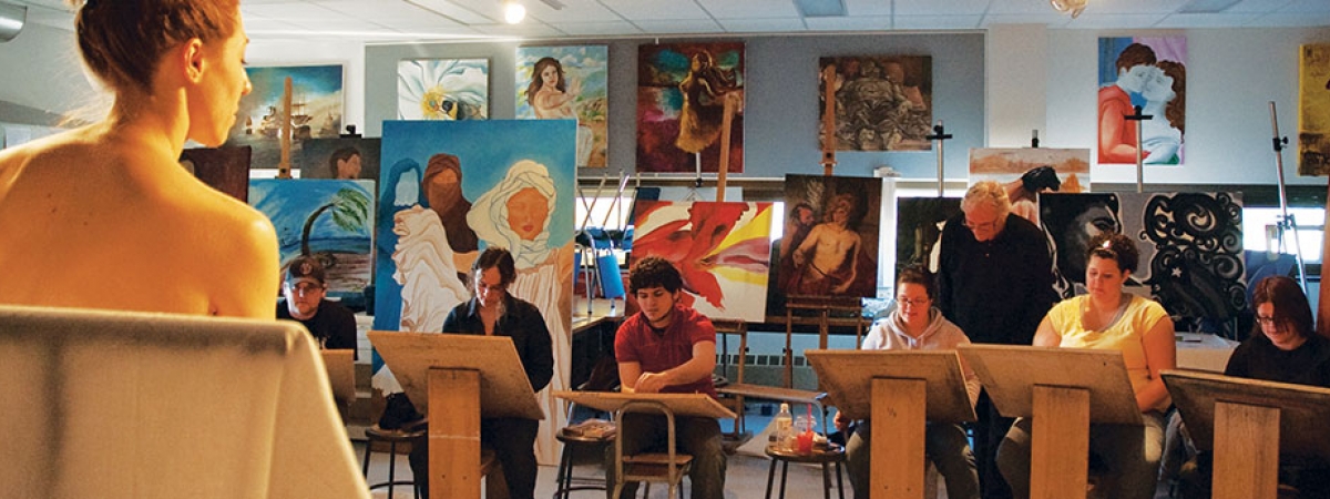 students painting in a classroom