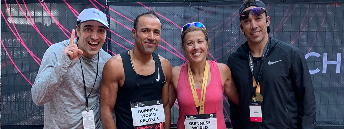 Alumni siblings Margarida and Paulo stand with their two brothers