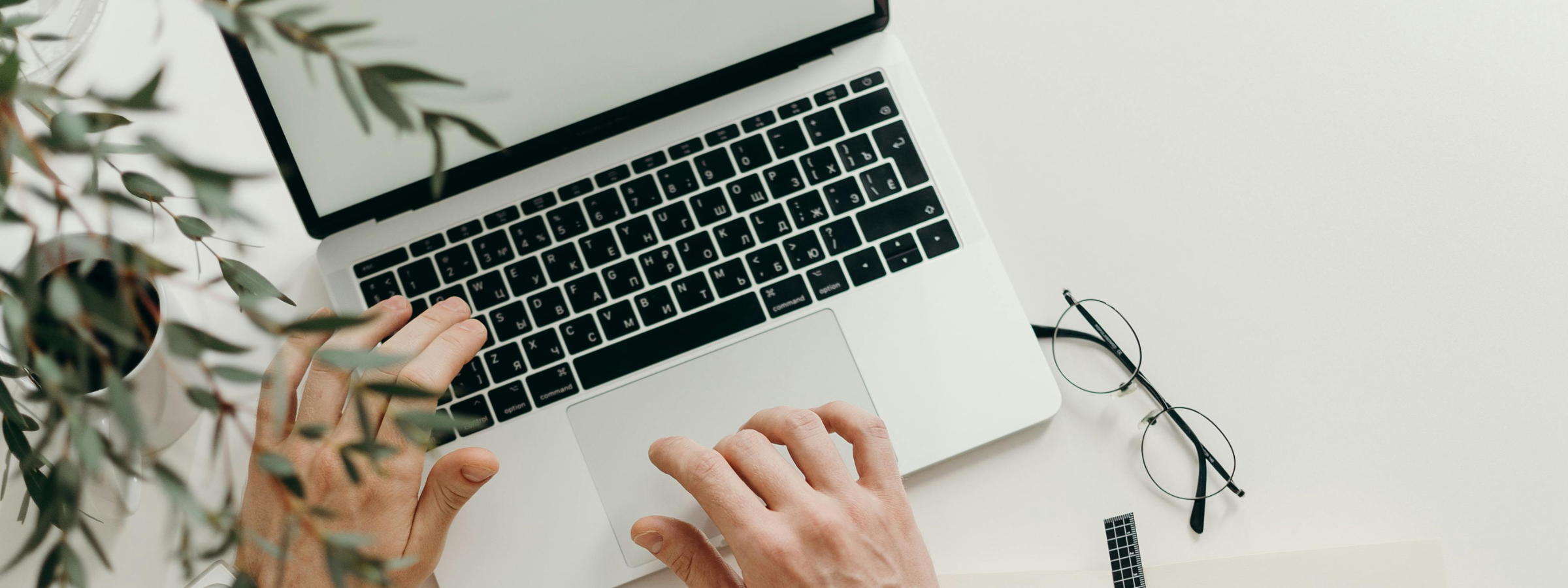 hands typing on a computer