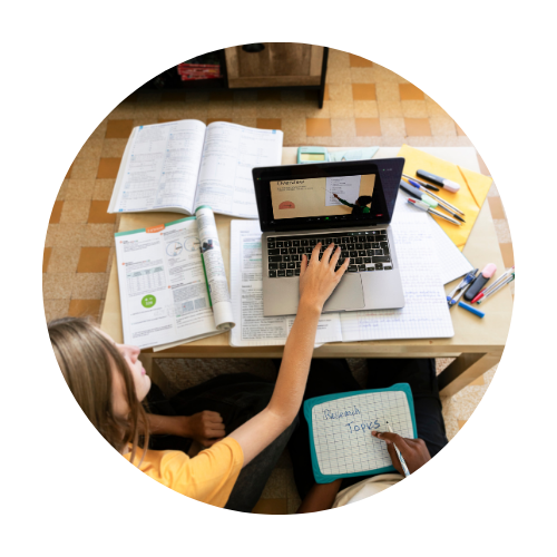 Two individuals working on developing course materials for students.