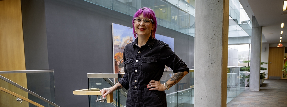 Lindsay Sullivan stands in the university library
