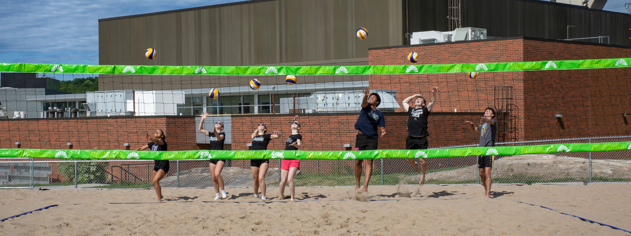 Jr. Lakers perform a ceremonial serve at the grand opening 