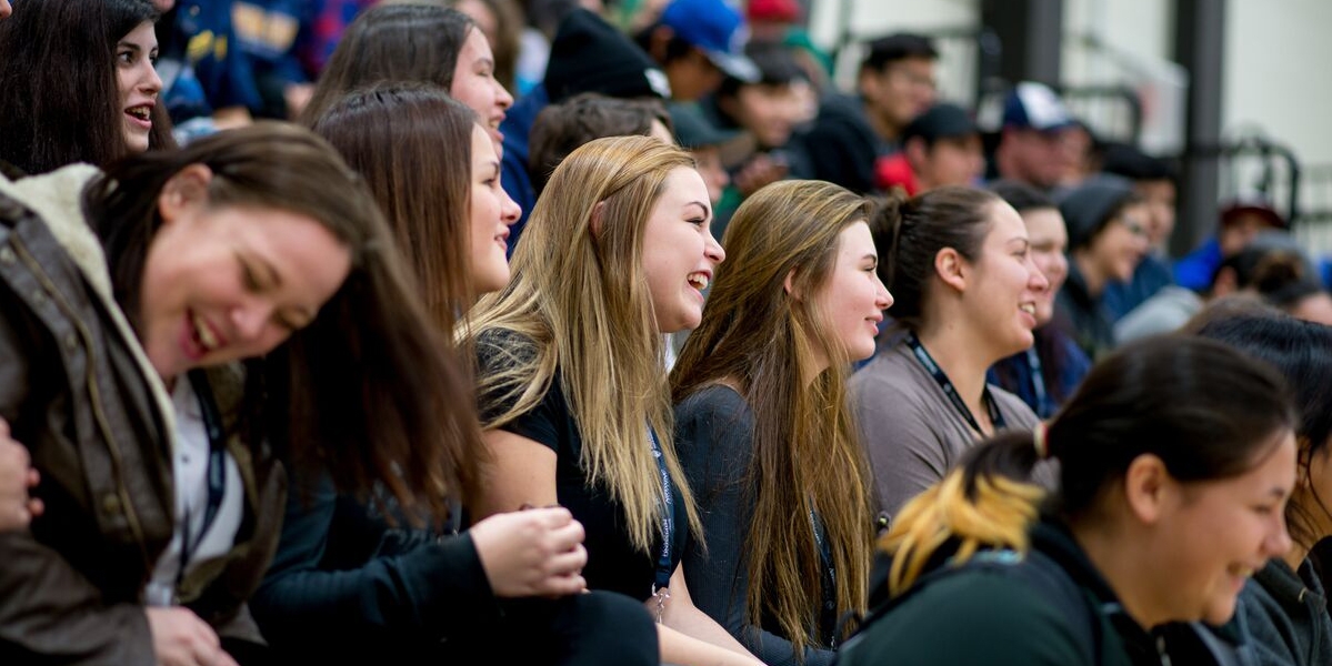 Crowd reacting with smiles