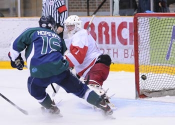 Photo of Lakers hockey player, Hopewell, scoring goal