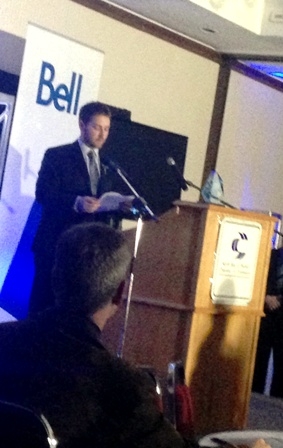 Photo of Bobby Ray speaking at a Chamber of Commerce podium