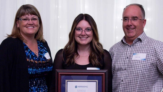 Megan Odd Rising Star Alumni Award winner with family