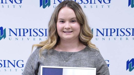 Mercedes Parsons with award