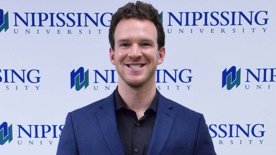 Nicholas Hoey with award