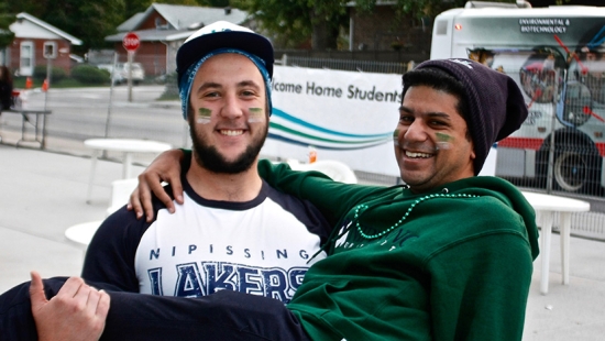 Two people outside Hockey game