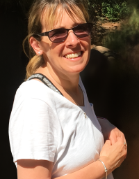 Laura Frank in front of a nature background