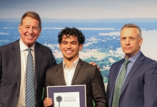 photo of Dr. Scott Russell, Chancellor of Nipissing University, Alexander Domingos, DMLA Recipient in the Campus category, and Dr. Kevin Wamsley, President and Vice-Chancellor of Nipissing University