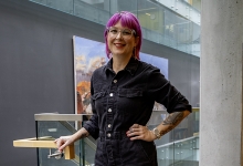 Lindsay Sullivan stands in the university library
