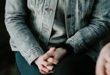 Student with hands clasped in lap