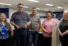 UTS Team Members left to right: Vansh Tyagi, Heather Hersemeyer, Greg Ferguson, Tom Watkins, Shelley Demers, Maria Cooper, Pauline Teal, with Greg holding their award trophy. 