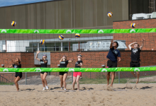 Jr. Lakers perform a ceremonial serve at the grand opening 