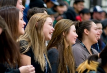 Crowd reacting with smiles