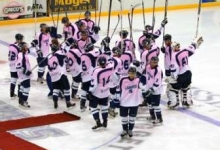 Pink the rink team on ice