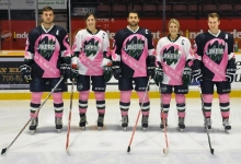 Hockey players is pink jerseys